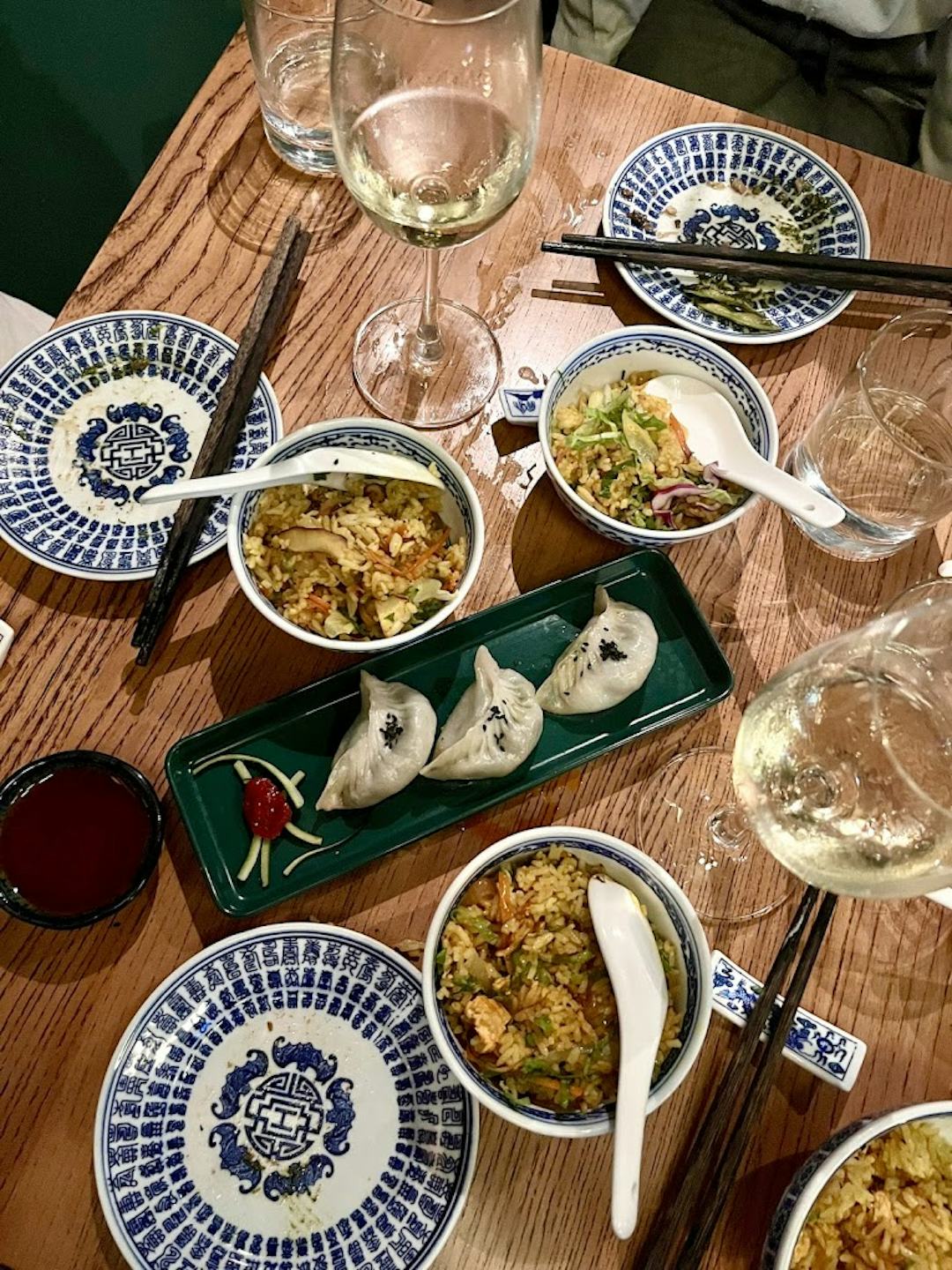 Fried rice and bowls on table.
